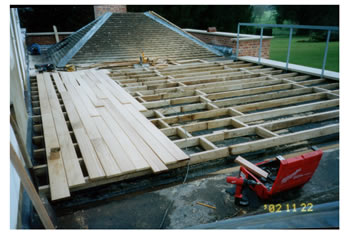 Wooden floor decking, Buntingford. Roof terrace with new wood decking..