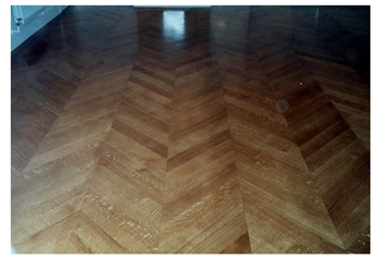 New parquet wood flooring, Chelsea, London. Oak parquet wood flooring in chevron pattern..