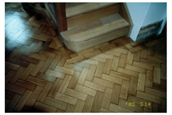 Wood floor repairs and stripping in Sevenoaks, Kent. We made repairs to this oak wood block floor with herringbone pattern..
