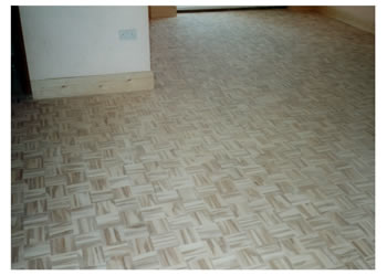 New wood flooring, St Albans, Herts.. Mosaic panels installed in a basket weave pattern and finished..