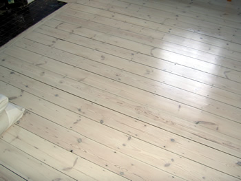 Bathroom wood floor with whitewash effect, Richmond. Pine floor boards, white wash finish..